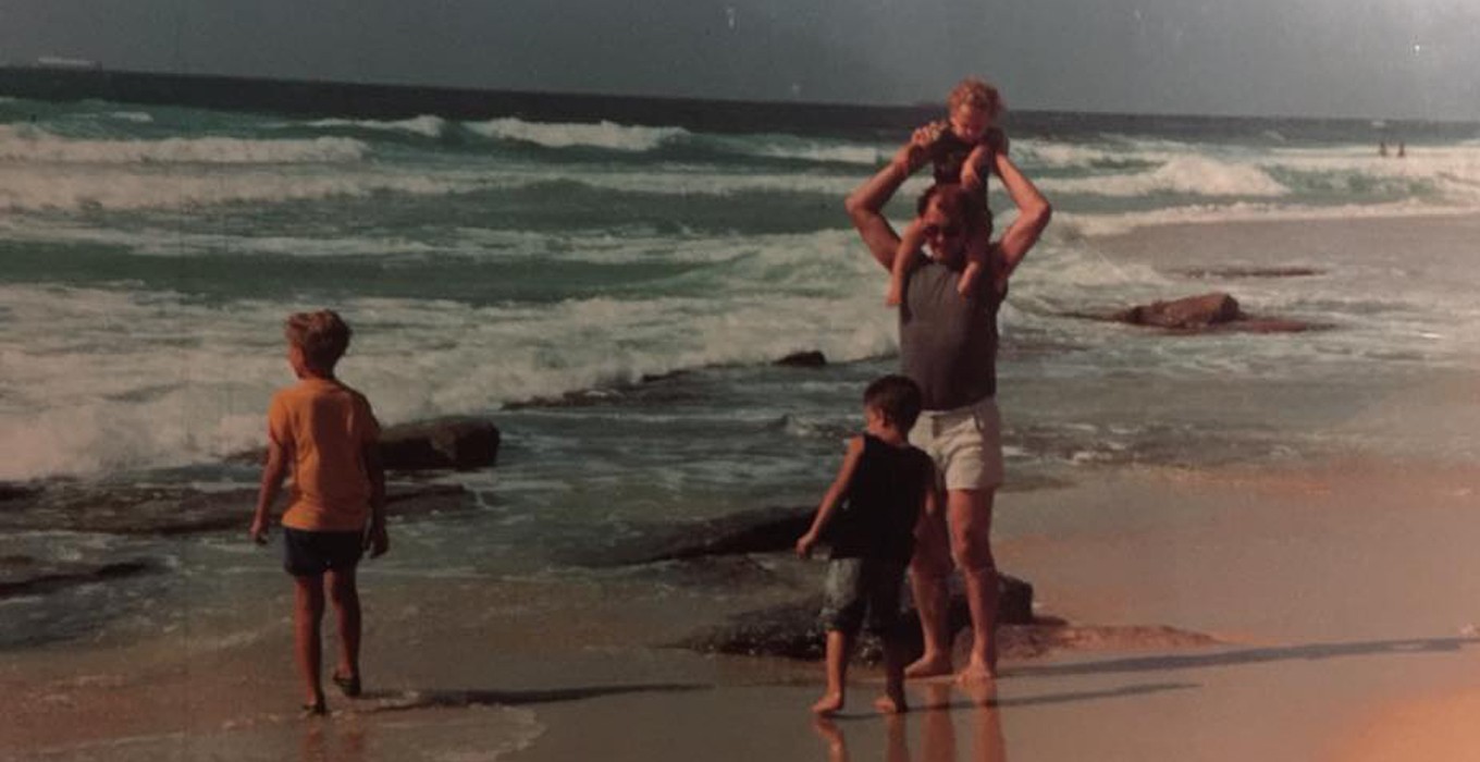 dad and bros on beach in israel