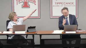 Tipp City Board of Education Member Anne Zakkour gives then President Simon Patry a Nazi salute as she says 'Sieg heil' during the board's working meeting, Sept. 12. Image: Tipp City BOE screenshot.