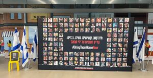A Bring Them Home banner with the faces of hostages take by Hamas in the Tel Aviv Central train station (Photo by Lonny Goldsmith/Jewfolk, Inc.)