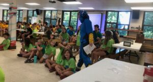 campers sitting inside messhall